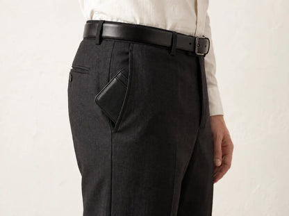 The Essential Wallet sitting flat in the front pocket of tailored trousers